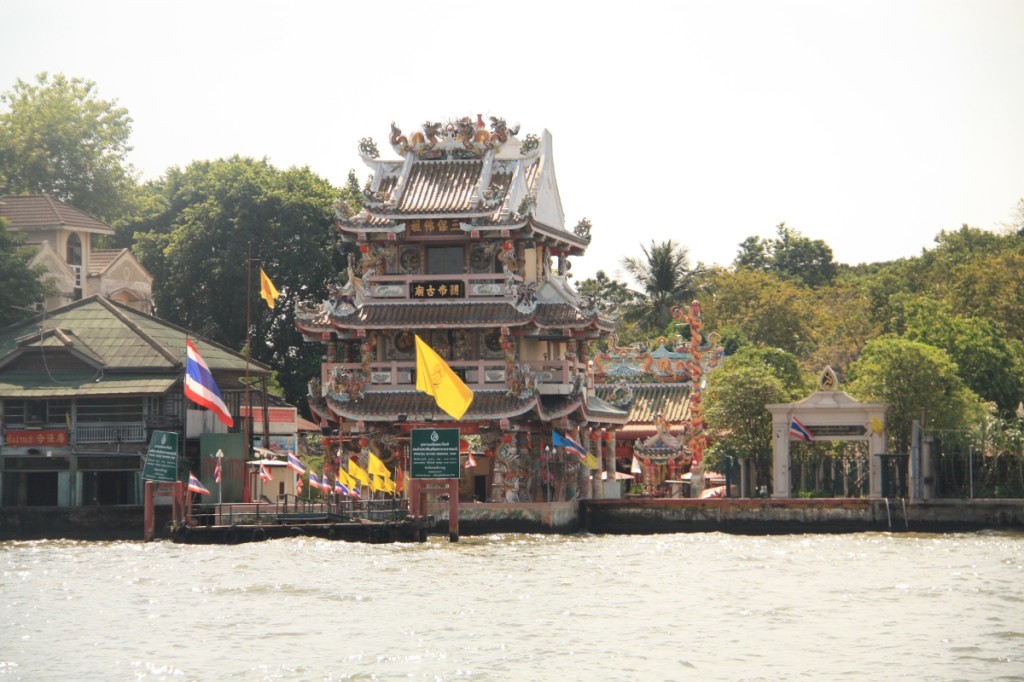 An ornate ferry stop on the side of the river.