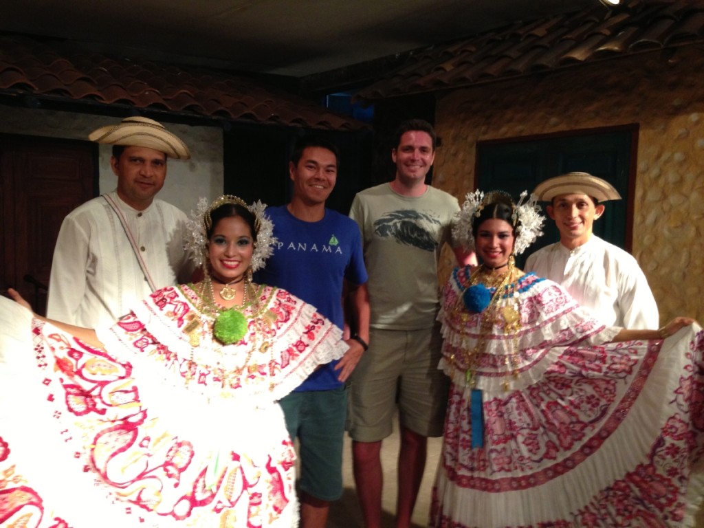 Talented dancers in beautiful costume... and a group of locals. 